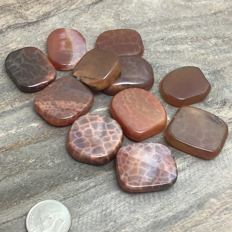 Fire Agate Lg Flat Palm.  Metaphysical and spiritual crystal gem stones rooted in Melbourne, Florida – Each product carries the natural essence of Brevard County’s sun, sea, sand, and soil. Essential Elements Wellness 